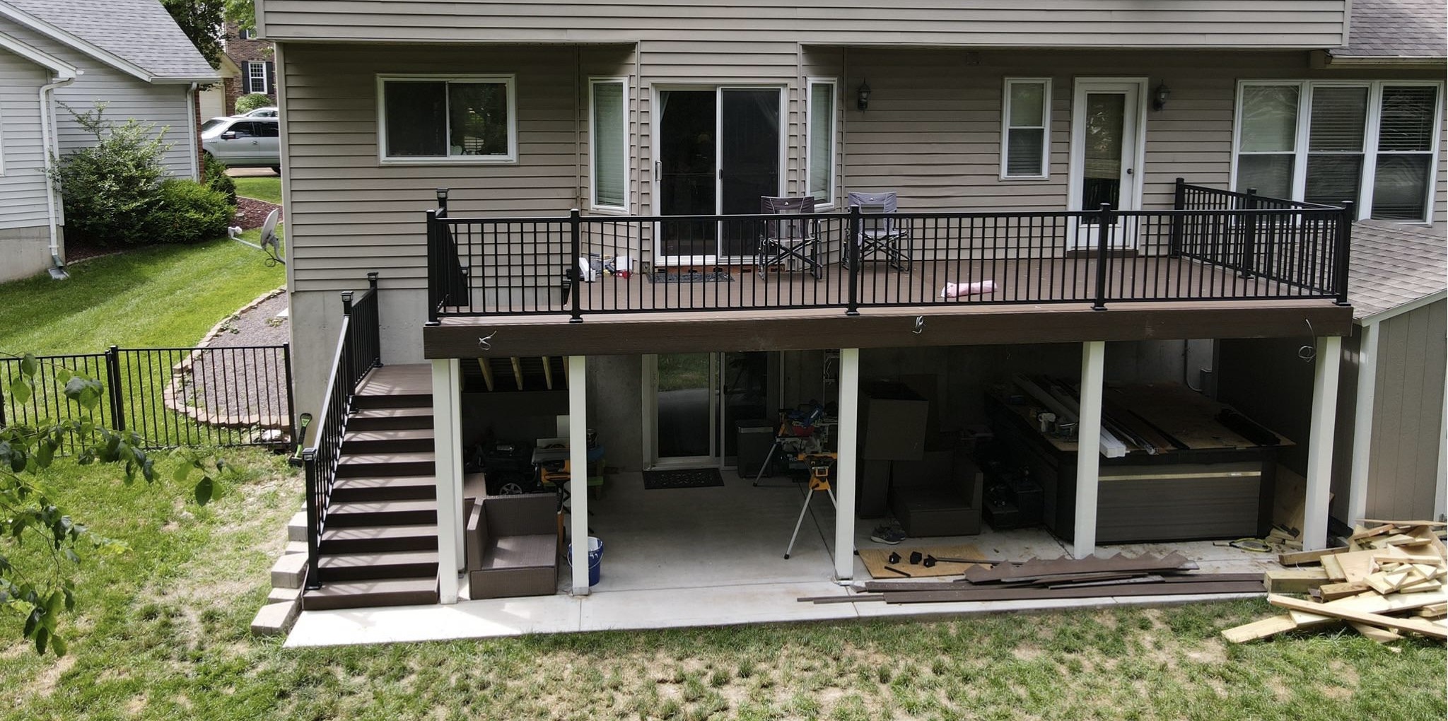 Rebuilt composite deck with new siding and refreshed rear exterior after