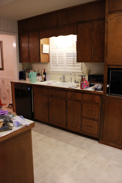 Dated dark wood kitchen before remodel